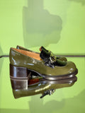 Heel detail of Chie Mihara XYZEN green and brown leather shoes
